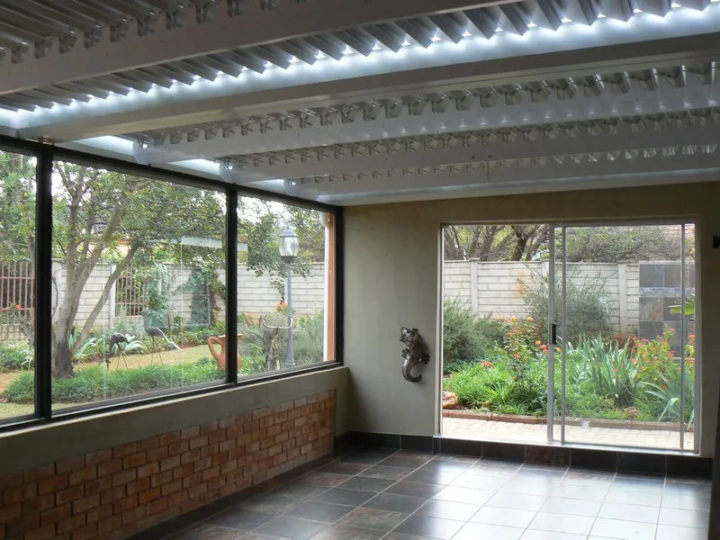 Louvre roof over an enclosed patio at an inland home