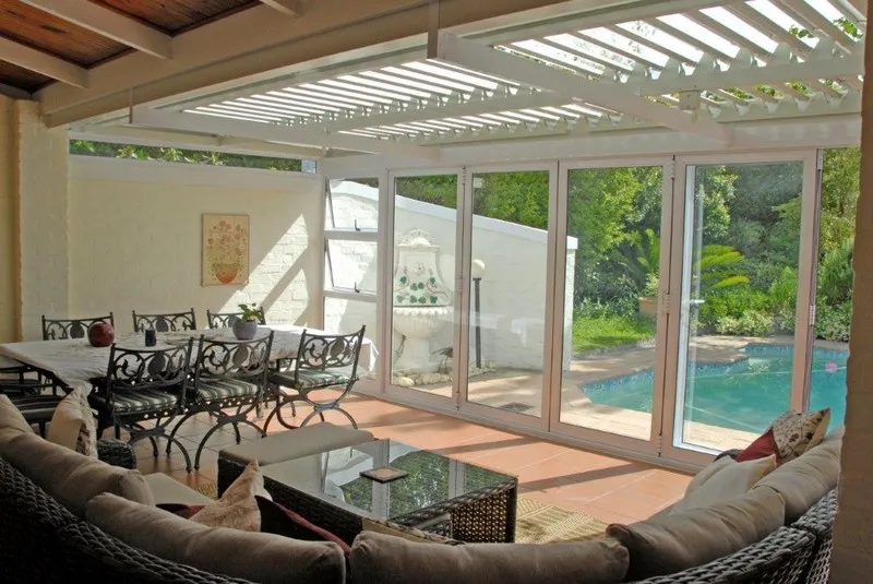 Awning with enclosed louvred aluminium sides making an outdoor room
