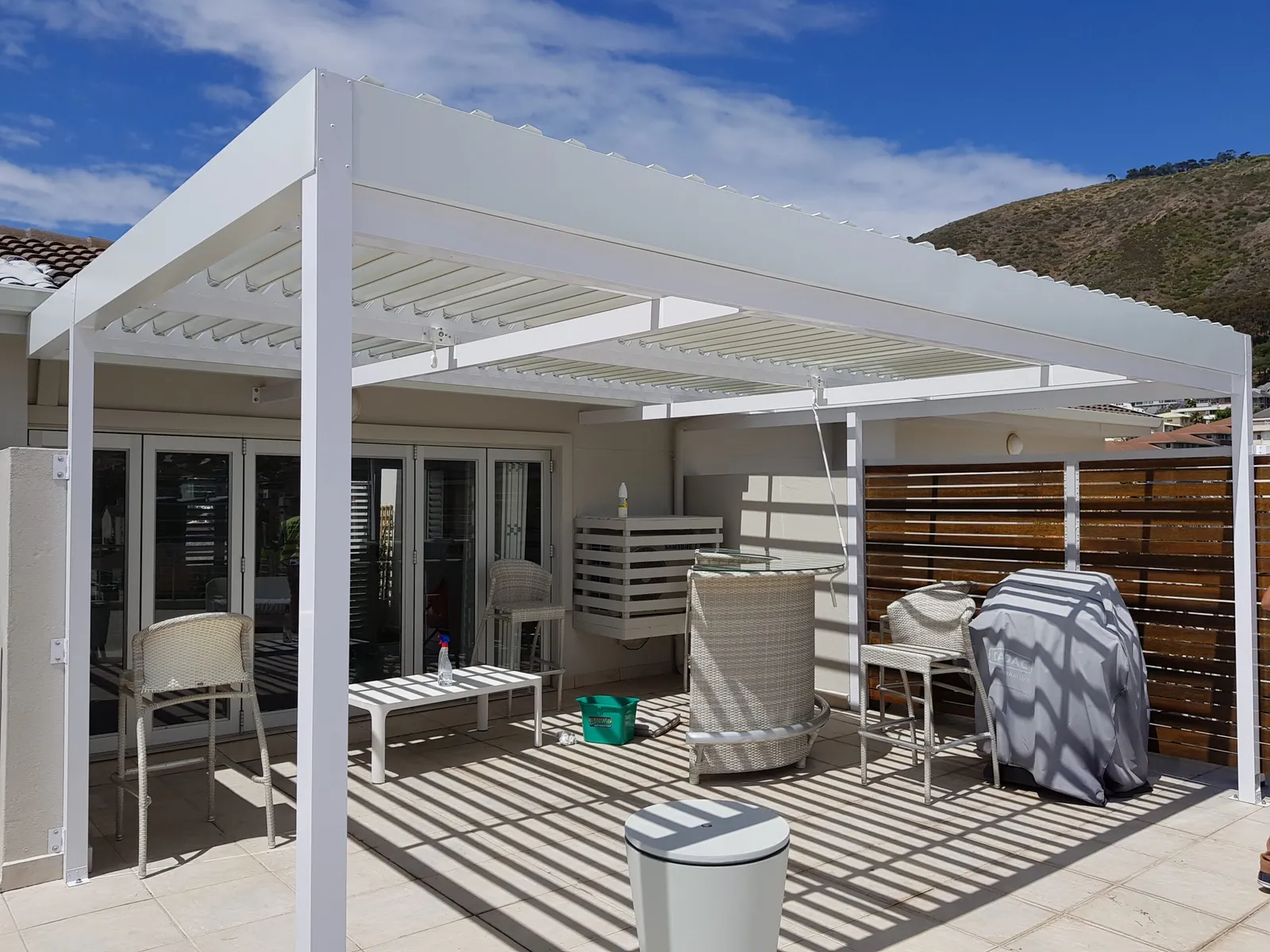 White louvre awning over a Cape Town terrace