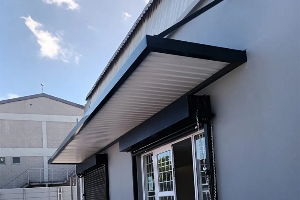 Fixed roof awning extending over a patio